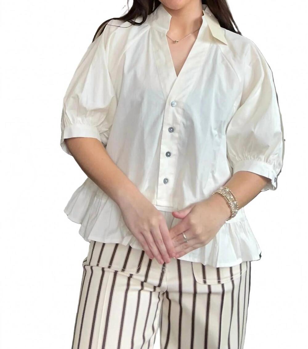 NEW ENTRO boutique style ruffle hem blouse in cream